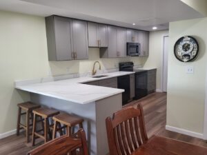 A completed kitchen remodeling project with new cabinets and countertops by Top Gunn Family Construction in Truxton, MO.