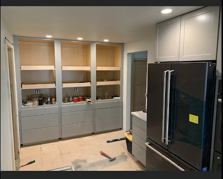 Kitchen renovation in progress, featuring new gray cabinets and appliance installation by Fisher Construction, LLC in Selah, WA.