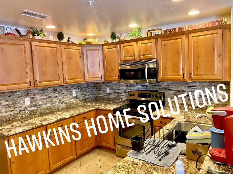 A complete kitchen renovation with new wooden cabinets and appliances by Hawkins Home Solutions in Glendale, AZ.