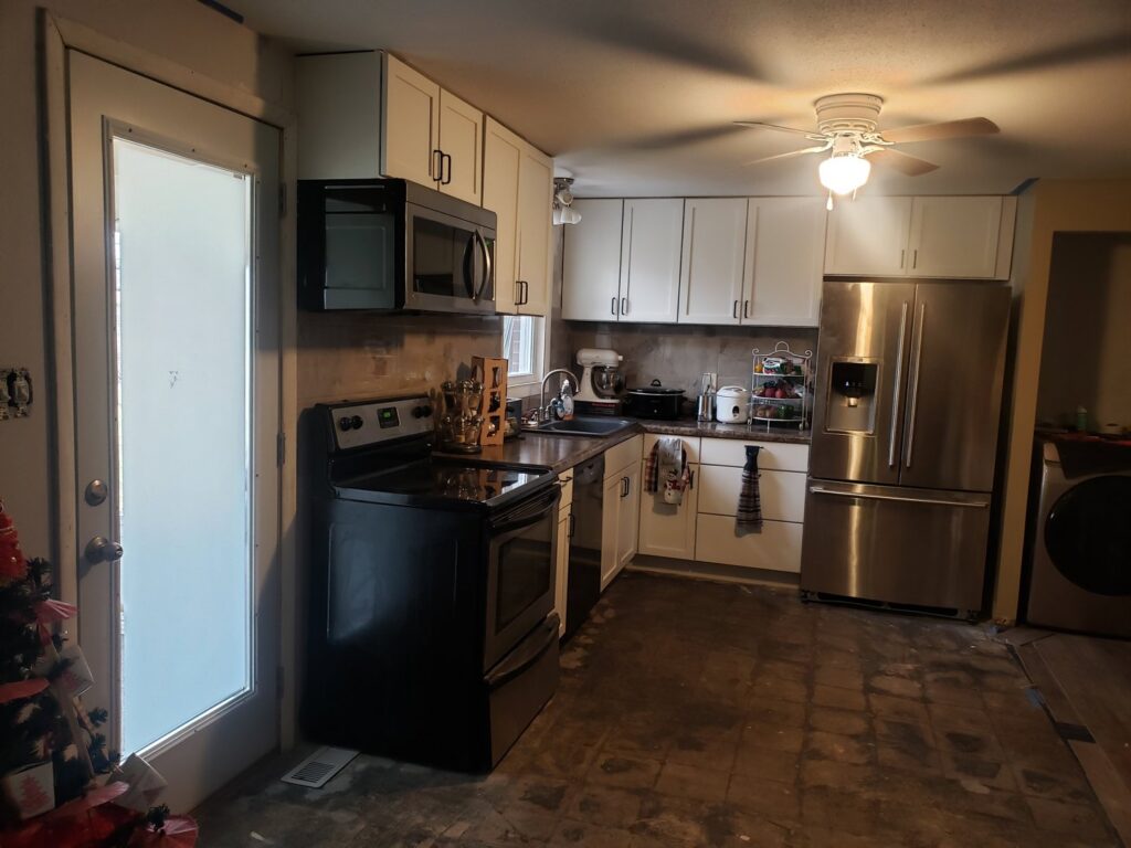 A kitchen undergoing renovation with new cabinets and appliances installed by Urban Restoration, LLC in Indianapolis, IN