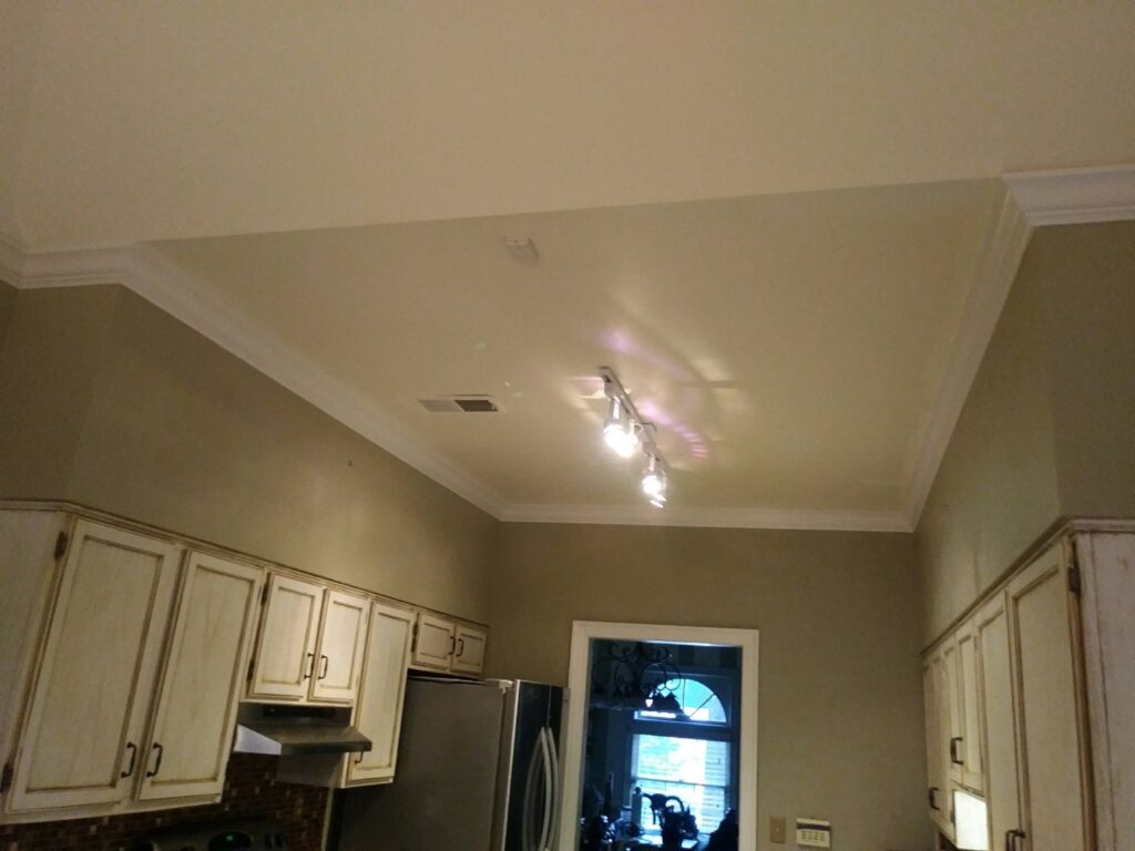 A renovated kitchen featuring new cabinets and ceiling lights by Custom Carpentry Service in Knoxville, TN.