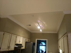 A renovated kitchen featuring new cabinets and ceiling lights by Custom Carpentry Service in Knoxville, TN.