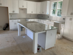 Kitchen renovation with new cabinets and countertops being installed by Diamond Stone Works in Virginia Beach, VA