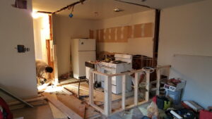 A kitchen undergoing renovation and demolition, showcasing services by Quality Services, LLC in Alexandria, VA.