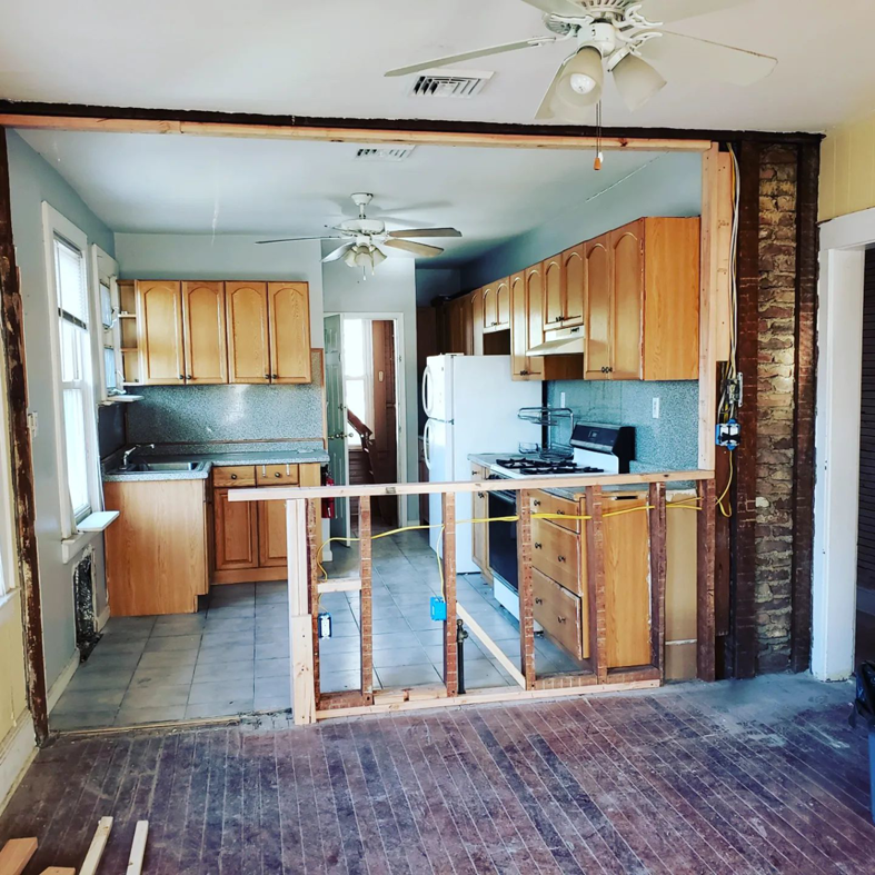 Kitchen renovation in progress with new framing for a half-wall by CJM Builders Inc in Wilmington, MA.