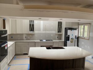 A kitchen renovation in progress showing newly installed cabinets and island countertop by Counter Fitters in Savannah, GA