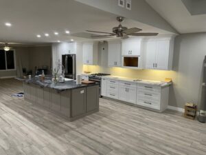 A kitchen renovation in progress with new cabinets and an island being installed by MGD Builders in Phoenix, AZ.