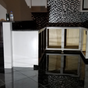 A kitchen renovation project in progress with new cabinets and backsplash tiling by Tile Works inc in Naperville, IL.