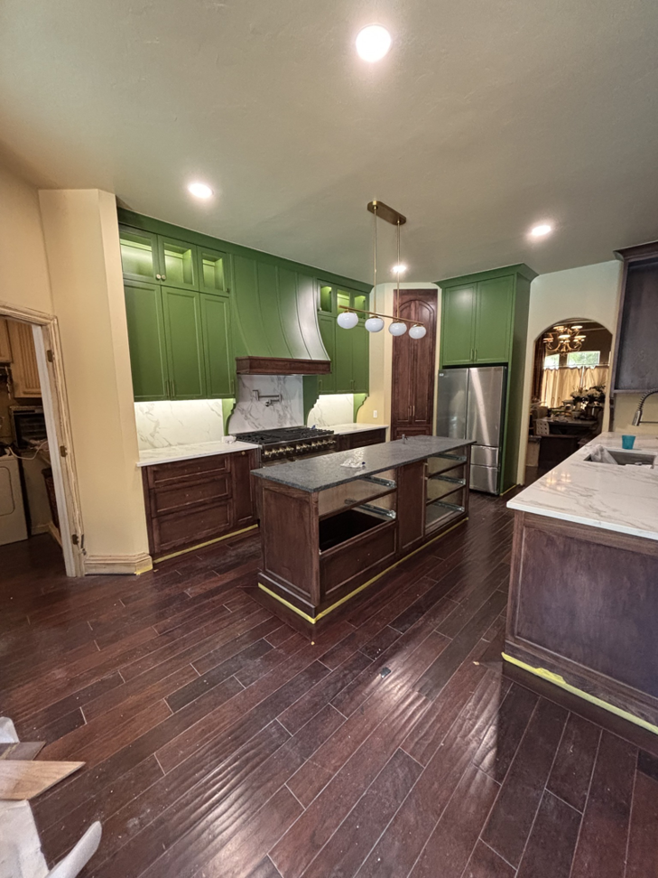 Kitchen renovation in progress, showing an unfinished island and new cabinets by New Era Painting & Construction, Jefferson, NC.