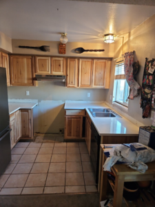 A full kitchen renovation featuring new cabinets and counters by Pro Helping Hands Renovation in Colorado Springs, CO.