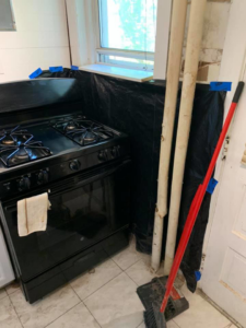 Kitchen renovation preparation with protective sheeting and tools by Tawfiq Services LLC in Philadelphia, PA