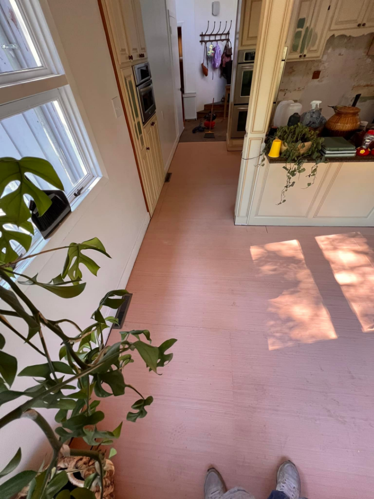 A kitchen renovation in progress, showing new subfloor installed and existing cabinets, by Bryder Construction in Greenville, SC.