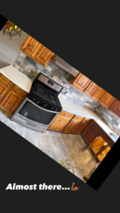 A newly renovated kitchen with modern cabinets and backsplash by Tawfiq Services LLC in Philadelphia, PA