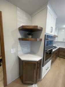A newly renovated kitchen corner with subway tile backsplash and custom cabinets installed by K&T PRO Painting in St. Cloud, MN.