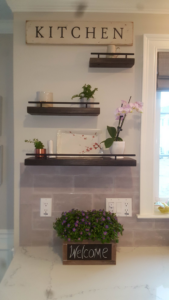 Newly installed kitchen shelves and tiled backsplash in a remodeled kitchen by DiBenedetto Building & Remodeling in Worcester, MA.