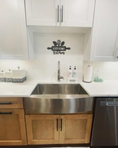 A newly installed kitchen sink with a white subway tile backsplash and modern cabinets by Garrett Group Construction in Philadelphia, PA.