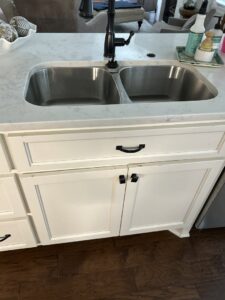 Newly installed kitchen sink and cabinets by BK's Handyman Services in Carlton, OR.