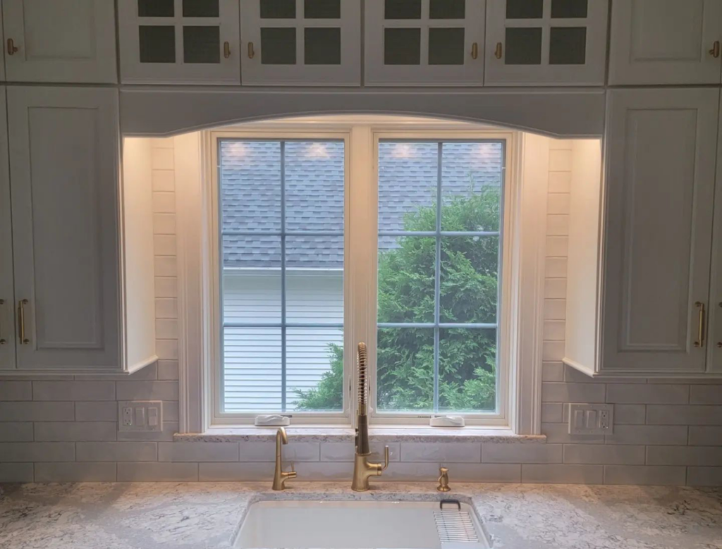 Kitchen sink, faucet, and subway tile backsplash installation by Walker Kitchen Design in Granby, CT.