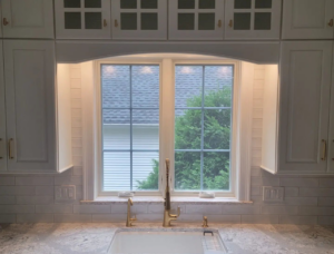 Kitchen sink, faucet, and subway tile backsplash installation by Walker Kitchen Design in Granby, CT.
