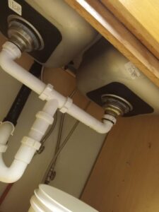 New plumbing installed under a kitchen sink by Friendly Handyman LLC in Wichita, KS