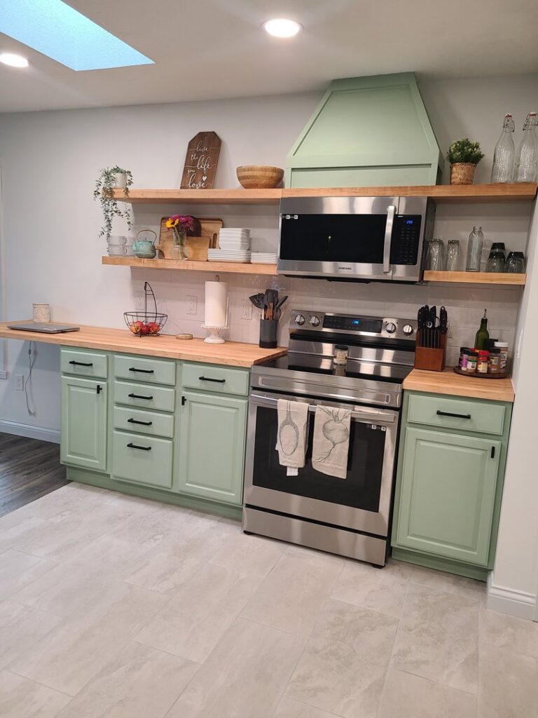 Kitchen with new stove, microwave, and open shelving installed by True North Builders in Franktown, CO.