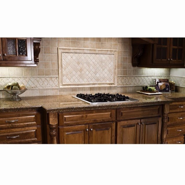 A newly installed kitchen tile backsplash and granite countertops by Unique Construction Services in Knoxville, TN