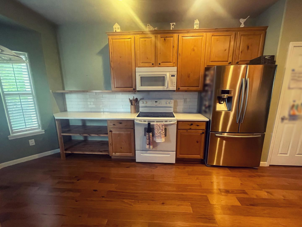 A kitchen update featuring new countertops, subway tile backsplash, and custom shelving by Tanner Custom Carpentry in Loveland, CO.