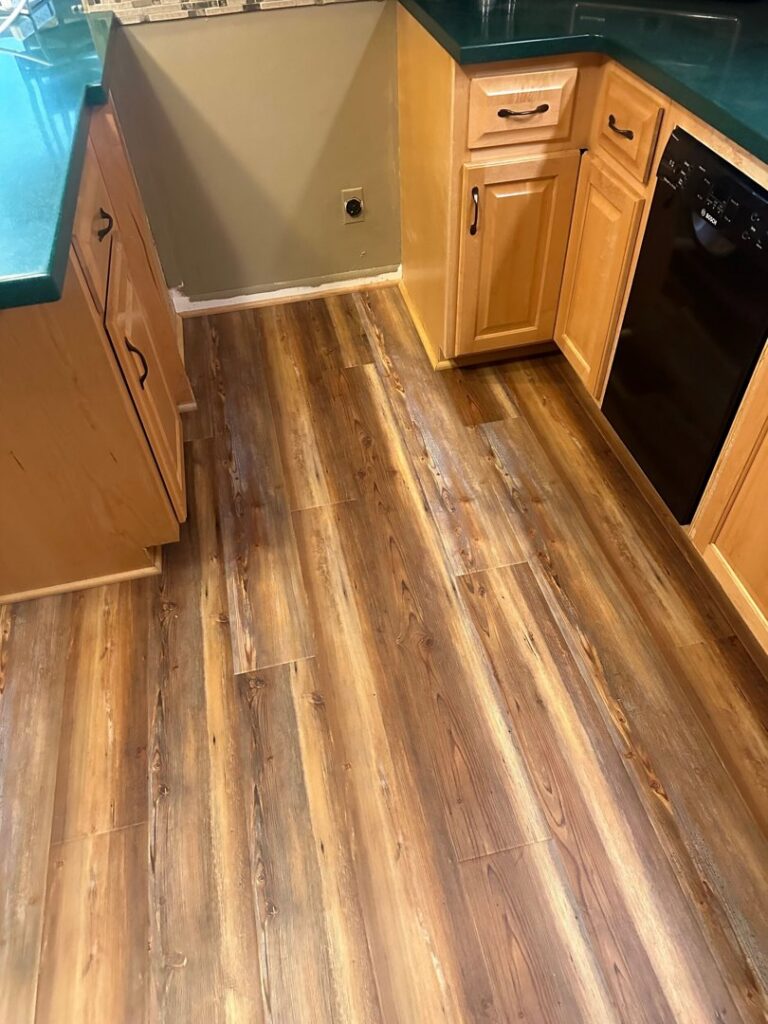 Kitchen with durable vinyl plank flooring installed by D E Custom Floors in Waukesha, WI.