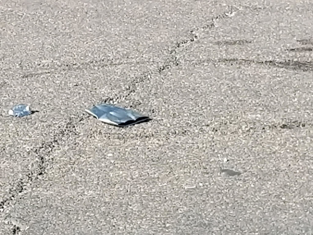 A red Kubota excavator performing earthmoving or demolition work for AZ Saw & Remove LLC in Gilbert, AZ.