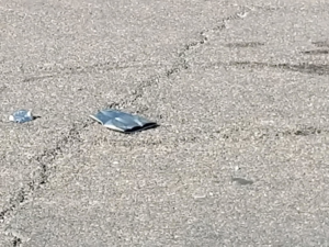 A red Kubota excavator performing earthmoving or demolition work for AZ Saw & Remove LLC in Gilbert, AZ.