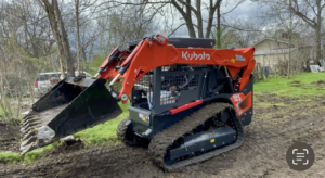 A Kubota skid steer loader used for land clearing and excavation services by EverSolutions LLC in Bessemer, AL.