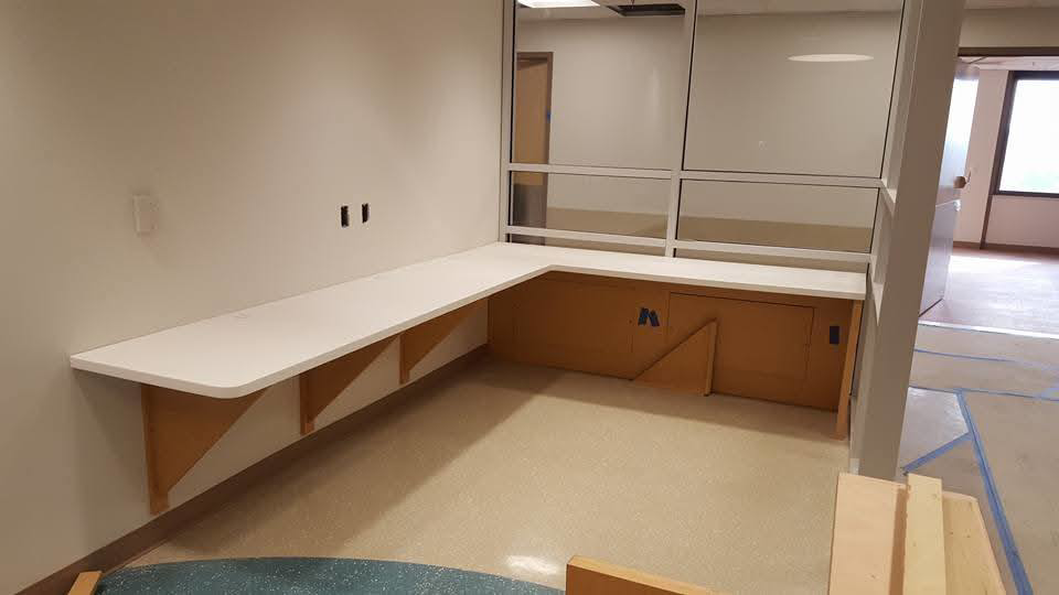 L-shaped countertop and cabinetry installation by Zubieta Kitchen & Bath LLC in Augusta, GA.