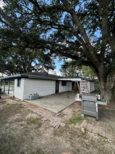 A ladder and construction tools on a patio, indicating ongoing work by Nugent Construction LLC in River Edge, NJ.