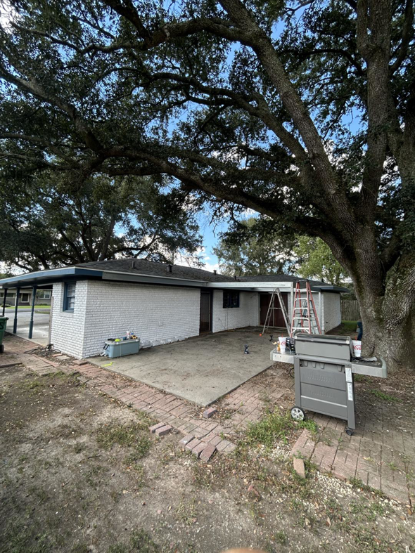 A ladder and construction tools on a patio, indicating ongoing work by Nugent Construction LLC in River Edge, NJ.