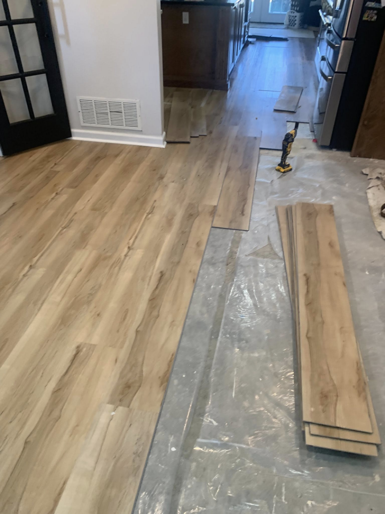 Laminate flooring installation in progress by KMK Construction & Remodeling in Southaven, MS.