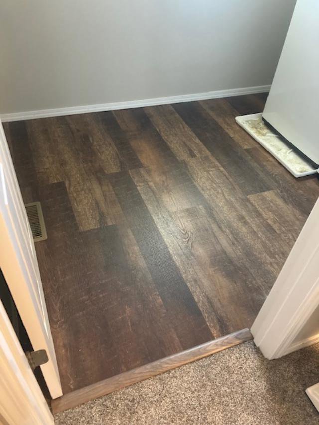 Newly installed laminate wood flooring in a room, a service provided by Rod's Handyman Services, LLC in Boise, ID.