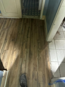 Professional laminate flooring installation in a home by Snell & Sons Construction LLC, serving Mobile, AL.