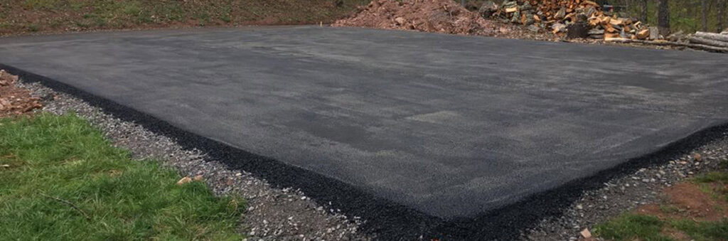 A large asphalt pad or parking area recently paved by Angeles Contractors LLC in New Oxford, PA.