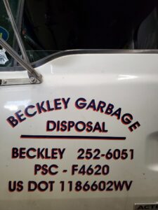 A large blue dumpster with the Whitecap Waste logo, ready for junk removal services in Beckley, WV.