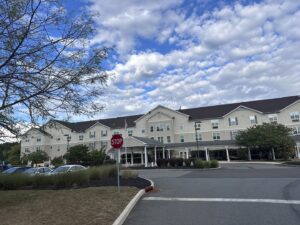 A large commercial or multi-unit residential building with a new roof installed by RHI Construction Inc in Philadelphia, PA.