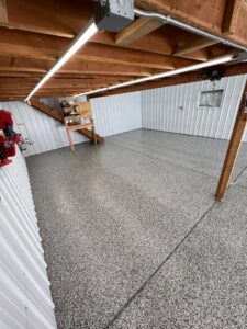 A large commercial space with a newly installed epoxy floor by Premier Edge Concrete in Grand Rapids, MI