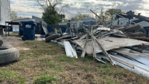 A large pile of construction debris and junk on the ground, ready for removal by All Seasons Junk Removal & Dumpster Services in Center Point, IA.