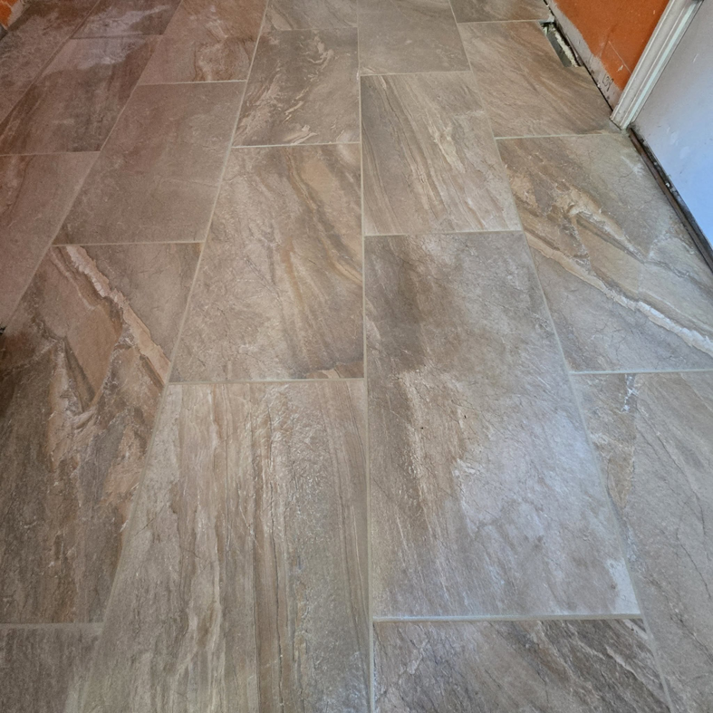 Professional installation of large format tile flooring by L.A. Floors in Madison, WI.