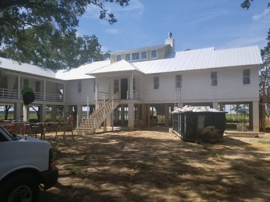 A large house undergoing exterior renovation by American Custom Exteriors in North Charleston, SC.