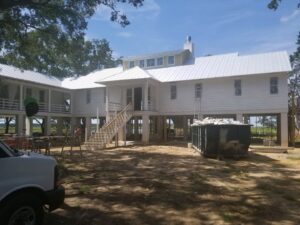 A large house undergoing exterior renovation by American Custom Exteriors in North Charleston, SC.