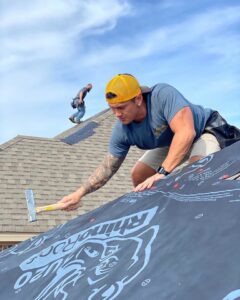 Multiple workers installing a new roof on a large residential house for Southern Roofing and Renovations Clarksville in Orlando, FL.
