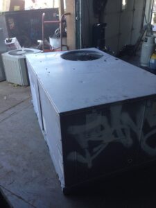 A large industrial HVAC unit inside a facility, ready for recycling by RZR Mechanical LLC in Phoenix, AZ.