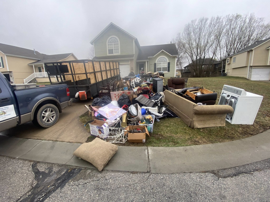 A large pile of household junk and debris awaiting pickup by Harris Family Hauling & Snow Removal LLC in Independence, MO.