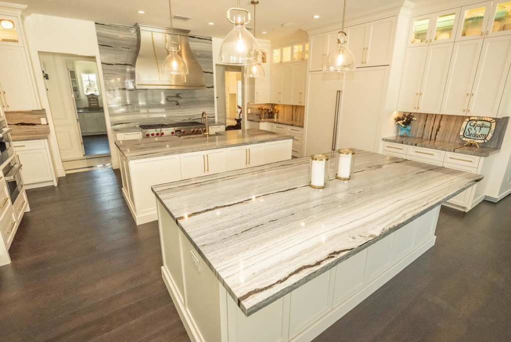 A spacious kitchen showcasing two stunning marble or granite islands installed by Accent Marble & Granite, Inc in Phoenix, AZ