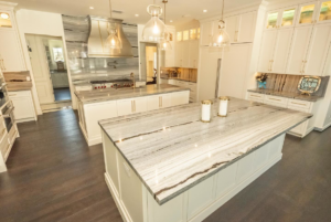 A spacious kitchen showcasing two stunning marble or granite islands installed by Accent Marble & Granite, Inc in Phoenix, AZ